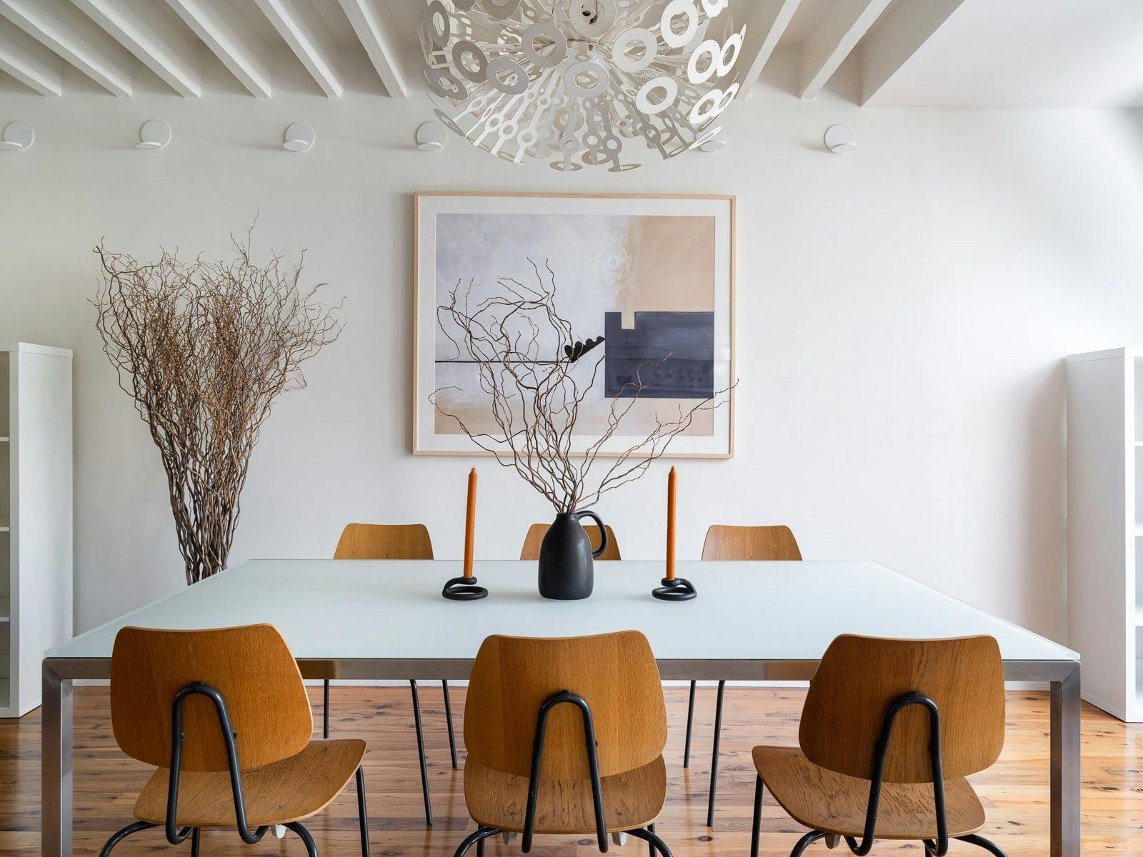Decorated dining room with unique circular dining fixture