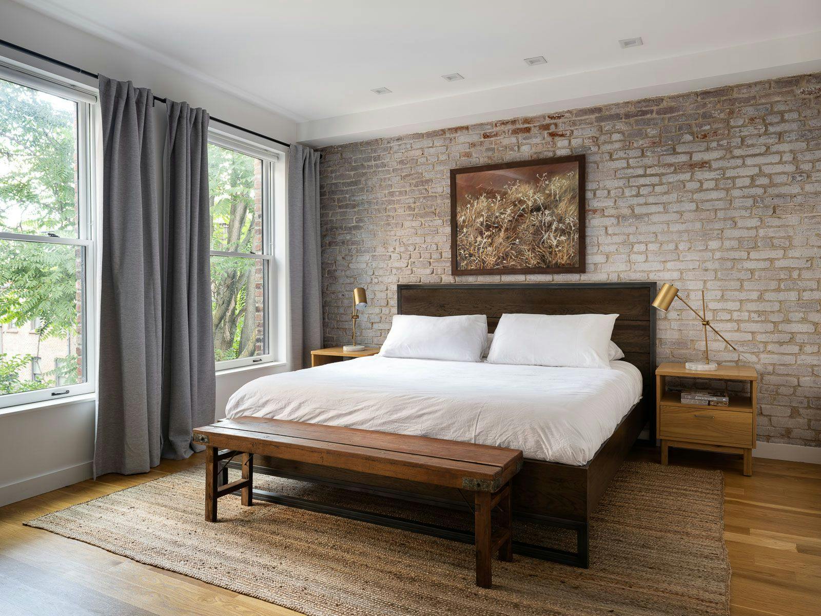 Bed in Brick Accent Wall Bedroom with 2 large sunlit windows